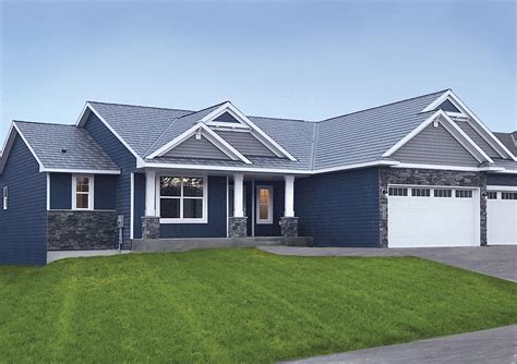 blue houses with black metal roofing|gray house with blue roof.